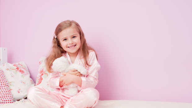 little girl in pink bedroom